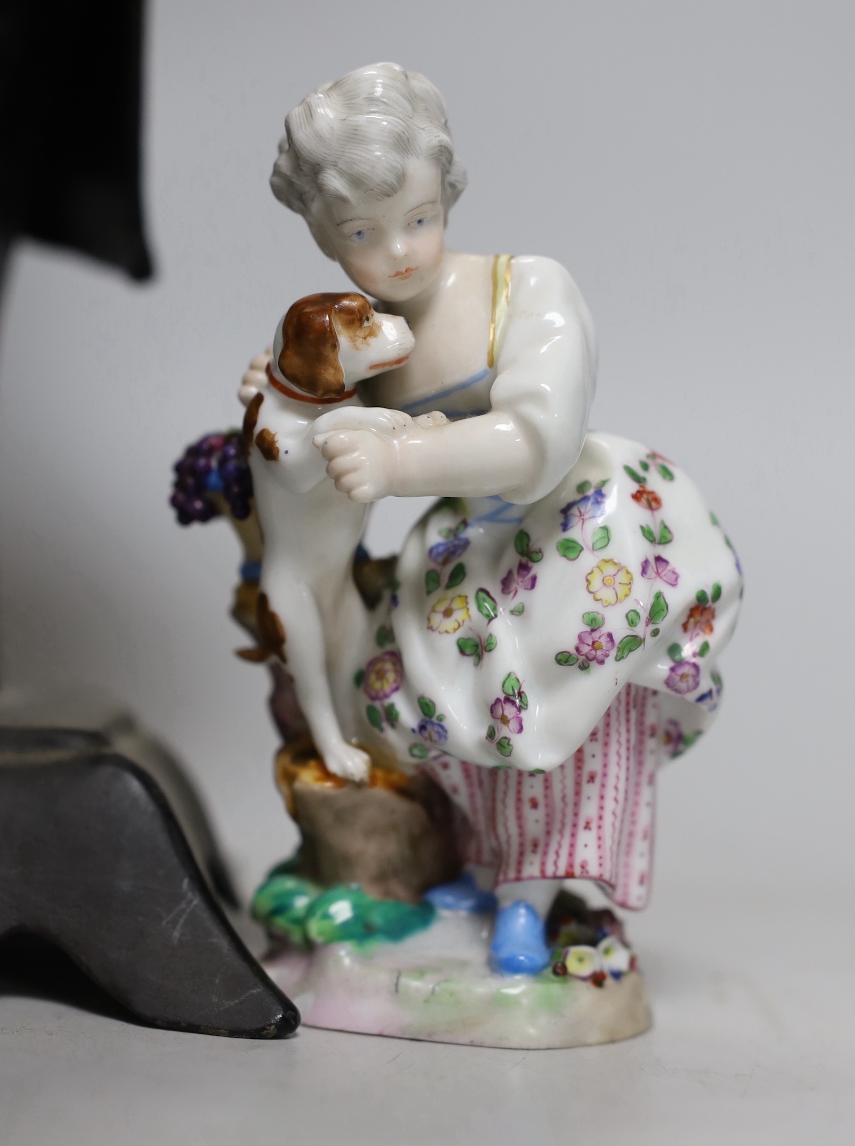 An American cast iron novelty 'John Bull' timepiece and a porcelain group